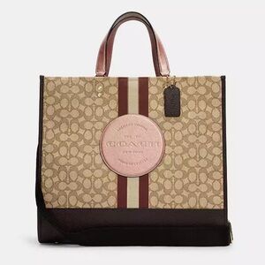 SOLD.. NWOT. Coach Dempsey Tote 40